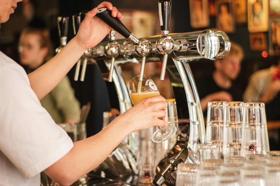 Bartender pulling a pint