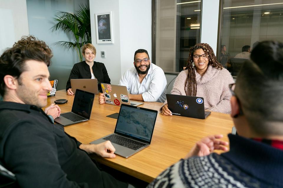 Team reviewing results on laptops