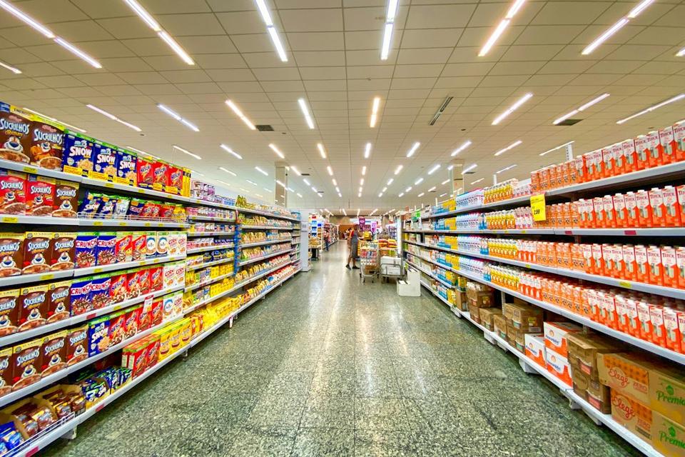 Supermarket aisle with stocked shelves